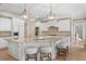 Gourmet kitchen featuring granite countertops, seating, and stainless steel appliances at 2281 Bransley Pl, Duluth, GA 30097