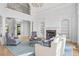 Inviting living room with a fireplace, built-in shelving, and comfortable seating, perfect for relaxation at 2281 Bransley Pl, Duluth, GA 30097