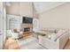 Spacious living room with stone fireplace, built-in bookshelves, and neutral decor at 2281 Bransley Pl, Duluth, GA 30097