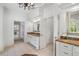 Bright main bathroom with separate vanities, marble countertops, tiled floors, and access to a walk-in shower at 2281 Bransley Pl, Duluth, GA 30097