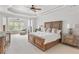 Spacious main bedroom with tray ceiling, columns, and seating area at 2281 Bransley Pl, Duluth, GA 30097