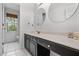 Bright bathroom with dual vanity, white countertops, large window and neutral tones at 4688 Oakleigh Manor Dr, Powder Springs, GA 30127