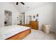 A well-lit bedroom featuring neutral walls, carpet floors, and wooden furnishings, creating a comfortable and inviting space at 4688 Oakleigh Manor Dr, Powder Springs, GA 30127
