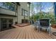 Deck with outdoor seating and a hot tub overlooking the backyard at 4688 Oakleigh Manor Dr, Powder Springs, GA 30127