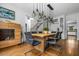Open dining area with hardwood floors, modern lighting fixture, and easy access to the kitchen at 4688 Oakleigh Manor Dr, Powder Springs, GA 30127