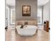 Spa-like bathroom featuring a freestanding tub, stone tiled accent wall, and natural light at 6585 Queen Mill Se Rd, Mableton, GA 30126