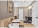 Luxurious bathroom featuring a standalone tub, tiled shower, and elegant fixtures creates a spa-like atmosphere for relaxation at 6585 Queen Mill Se Rd, Mableton, GA 30126