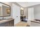 Spacious bathroom with dual vanities, walk-in closet and neutral tones creates a luxurious and functional space at 6585 Queen Mill Se Rd, Mableton, GA 30126