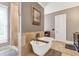 Elegant bathroom with a freestanding tub, walk-in shower, and stylish fixtures offers a serene and luxurious bathing experience at 6585 Queen Mill Se Rd, Mableton, GA 30126