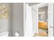 Bathroom featuring a toilet and bathtub, with view to vanity and mirror at 6585 Queen Mill Se Rd, Mableton, GA 30126