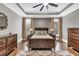 Serene bedroom with natural light, comfortable furnishings, and dark wood accents creates a relaxing and inviting retreat at 6585 Queen Mill Se Rd, Mableton, GA 30126