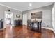 Cozy dining area with wood floors, gray walls, and easy access to the kitchen at 6585 Queen Mill Se Rd, Mableton, GA 30126