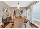 Elegant dining room with hardwood floors, stylish lighting, and neutral decor at 6585 Queen Mill Se Rd, Mableton, GA 30126