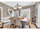 Charming dining room with a large table, and neutral walls and access to a wine fridge at 6585 Queen Mill Se Rd, Mableton, GA 30126