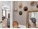 Hallway featuring a collection of hats and a mirror, leading into the bedroom at 6585 Queen Mill Se Rd, Mableton, GA 30126