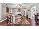 Cozy living room with hardwood floors, a fireplace, built-in shelving, and a comfortable sofa at 6585 Queen Mill Se Rd, Mableton, GA 30126