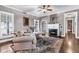 Bright living room showcasing hardwood floors, a fireplace, and built-in shelving at 6585 Queen Mill Se Rd, Mableton, GA 30126