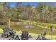 Picturesque pond featuring an outdoor lounge area and string lights at 6585 Queen Mill Se Rd, Mableton, GA 30126