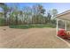 Lush backyard with professionally landscaped flowerbeds and plenty of space for outdoor activities at 122 Crestmont Dr, Canton, GA 30114
