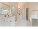 Bright bathroom with double vanity, white cabinets, and a separate shower at 122 Crestmont Dr, Canton, GA 30114