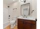 Well-appointed bathroom showcasing a vanity with a stylish mirror and a shower-tub combination at 122 Crestmont Dr, Canton, GA 30114