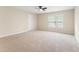 Large bedroom filled with natural light and soft carpeting creating a cozy retreat at 122 Crestmont Dr, Canton, GA 30114