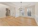 Spacious dining room featuring hardwood floors and a modern chandelier at 122 Crestmont Dr, Canton, GA 30114