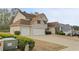 Exterior view of home with a two-car garage and traditional architecture at 122 Crestmont Dr, Canton, GA 30114