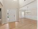 Bright foyer with hardwood floors, wainscoting, and a tray ceiling in the dining room at 122 Crestmont Dr, Canton, GA 30114