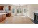 The eat-in kitchen features cherry wood cabinets, stainless steel appliances, and light-colored hardwood floors at 122 Crestmont Dr, Canton, GA 30114