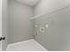 Convenient laundry room equipped with upper shelving and easily accessible washer/dryer hookups at 122 Crestmont Dr, Canton, GA 30114