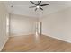 Bright primary bedroom featuring hardwood floors, a vaulted ceiling with fan, and neutral tones at 122 Crestmont Dr, Canton, GA 30114