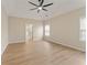 Spacious primary bedroom featuring hardwood floors and a vaulted ceiling with fan at 122 Crestmont Dr, Canton, GA 30114