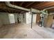 Unfinished basement offering utilitarian space with a water heater, door, and utilities, providing ample storage potential at 1464 Colony East Cir, Stone Mountain, GA 30083