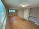 Finished basement area featuring hardwood floors, a bright window, and closet space, offering potential for customization at 1464 Colony East Cir, Stone Mountain, GA 30083