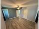 Comfortable bedroom featuring plank floors, neutral paint, a ceiling fan, and easy access to an attached bathroom at 1464 Colony East Cir, Stone Mountain, GA 30083