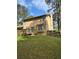Backyard view of home with deck, lawn, and traditional style at 230 Blue Heron Dr, Jonesboro, GA 30238