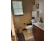 Cozy bathroom featuring a vanity, toilet, window, and shower with patterned curtain at 230 Blue Heron Dr, Jonesboro, GA 30238