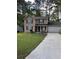 Charming two-story home with a well-manicured lawn and long concrete driveway at 230 Blue Heron Dr, Jonesboro, GA 30238