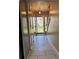 Hallway with tile flooring leading to an open front door at 230 Blue Heron Dr, Jonesboro, GA 30238