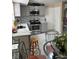 Updated kitchen area featuring stainless steel appliances and a glass table at 230 Blue Heron Dr, Jonesboro, GA 30238