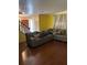 Inviting living room with wood floors, a comfortable couch, and a staircase at 230 Blue Heron Dr, Jonesboro, GA 30238