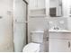 Compact bathroom featuring a shower, toilet, and sink with vanity at 2442 Wentworth Ne Dr, Atlanta, GA 30345