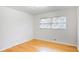 Cozy bedroom with hardwood floors and two windows for natural light at 2442 Wentworth Ne Dr, Atlanta, GA 30345