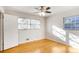 Sunlit bedroom featuring hardwood floors and bright white walls at 2442 Wentworth Ne Dr, Atlanta, GA 30345