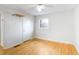 Well-lit bedroom with hardwood flooring and neutral wall color at 2442 Wentworth Ne Dr, Atlanta, GA 30345