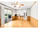 Bright living room with hardwood floors and a sliding glass door to the backyard at 2442 Wentworth Ne Dr, Atlanta, GA 30345