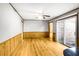 Open living room area boasting hardwood floors and natural light from a sliding door at 2442 Wentworth Ne Dr, Atlanta, GA 30345