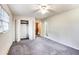 Spacious carpeted main bedroom with ceiling fan, closet, and adjacent bathroom at 2442 Wentworth Ne Dr, Atlanta, GA 30345