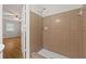 Cozy bathroom featuring a tiled shower with updated fixtures and a glimpse of the bedroom at 4606 Greensprings Rd, College Park, GA 30337